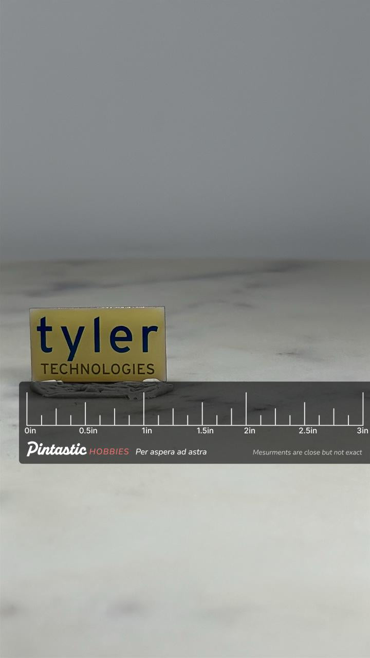 Tyler Technologies Pin: Cream Blue Enamel - Corporate Career Accessory with ruler overlay for size reference