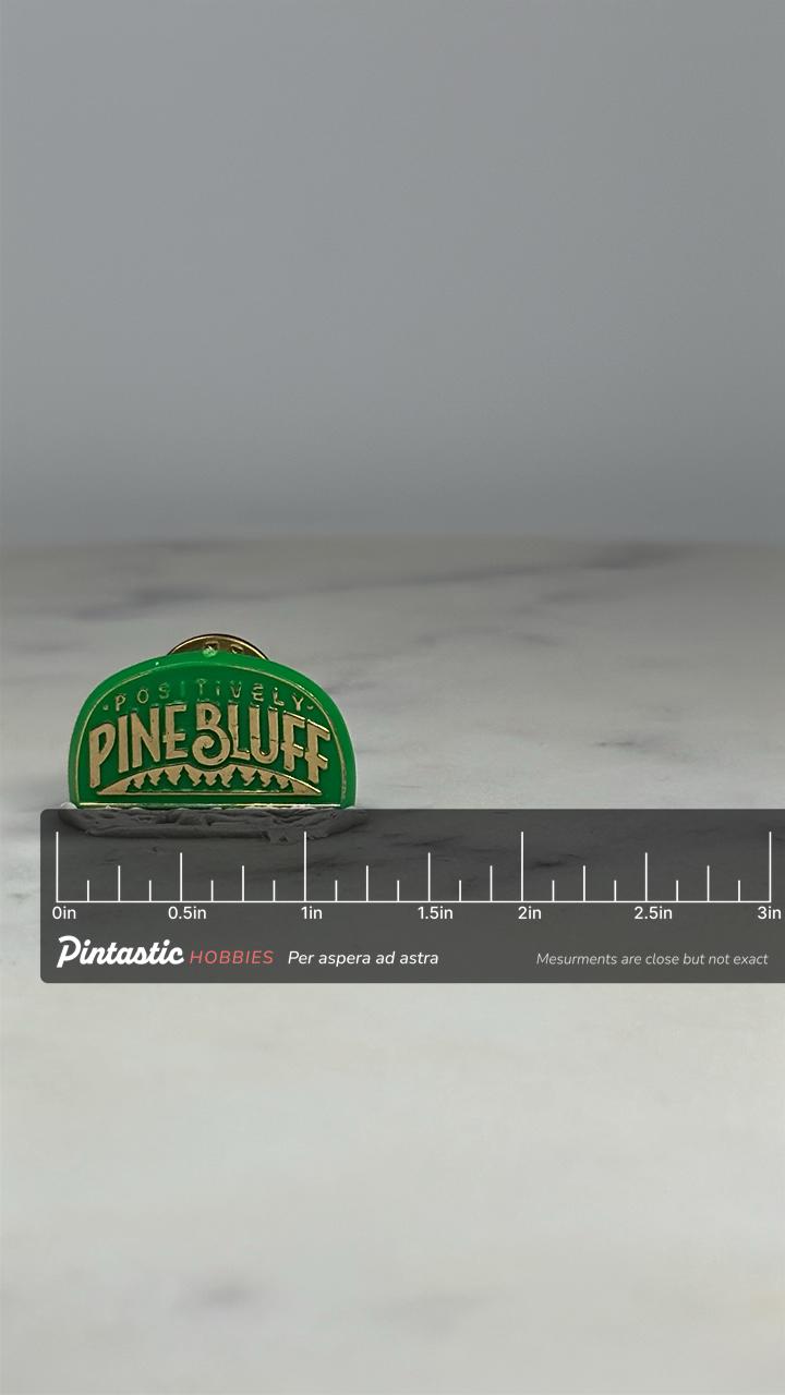 Pine Bluff Souvenir Pin: Green Gold Enamel - Retro Travel Accessory with ruler overlay for size reference