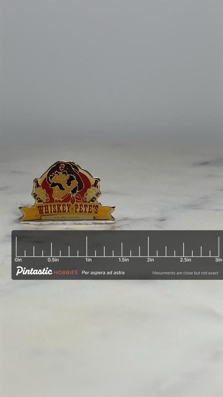 Whiskey Pete's Casino Pin: Red Gold Enamel - Vintage Hotel Accessory with ruler overlay for size reference