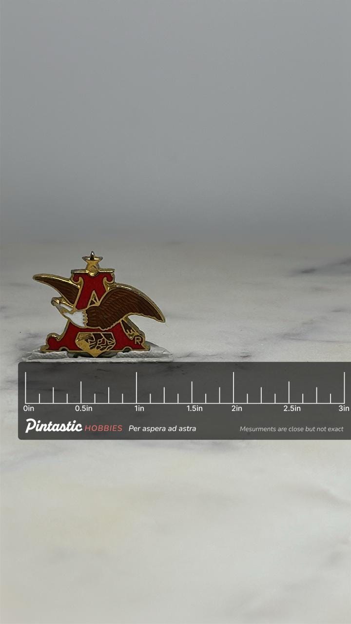 Anheuser Busch Logo Pin: Red Gold Enamel - Vintage Brewery Accessory with ruler overlay for size reference