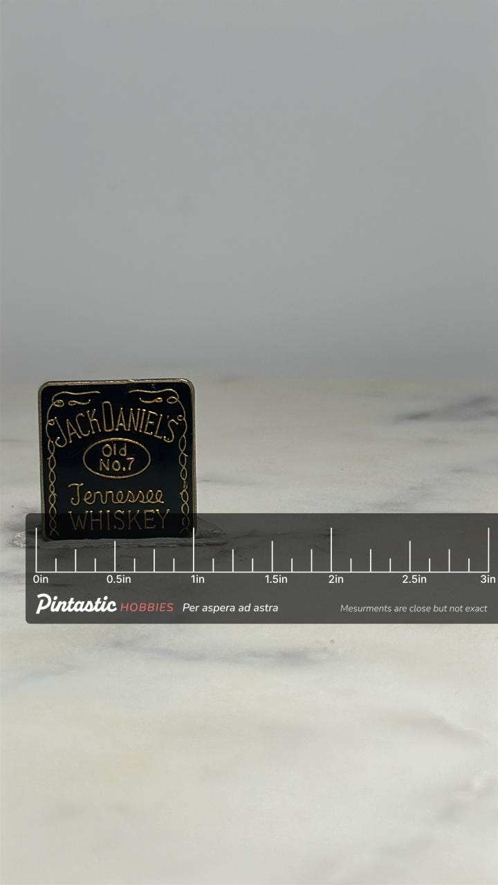 Jack Daniel's Whiskey Pin: Black Enamel Gold Trim - Vintage Bar Accessory with ruler overlay for size reference