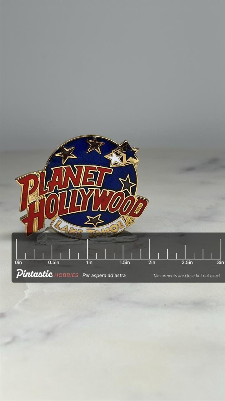 Planet Hollywood Lake Tahoe Pin: Gold & Blue Enamel - 1990s Souvenir Accessory with ruler overlay for size reference