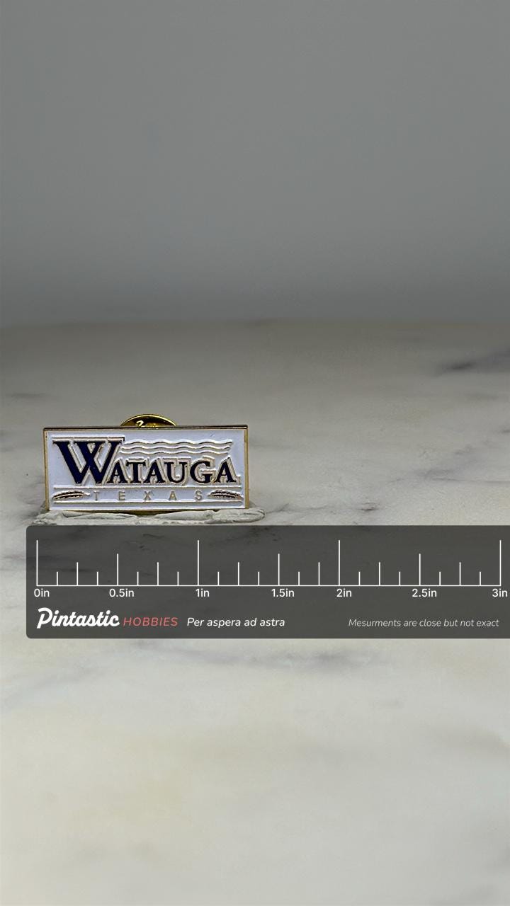 Watauga Texas Lapel Pin: White & Blue Enamel - City Souvenir Accessory with ruler overlay for size reference
