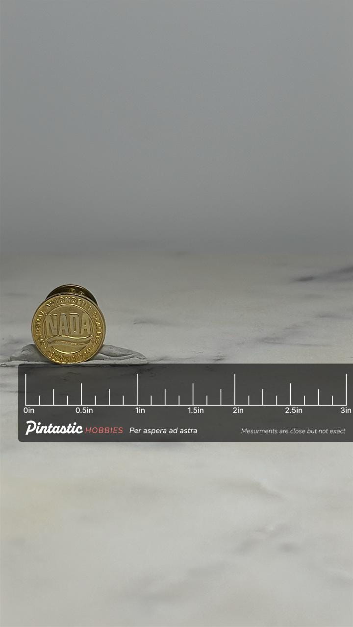 NADA Dealer Pin: Gold Tone Round - Vintage Auto Industry Accessory with ruler overlay for size reference
