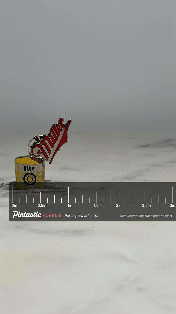 Miller Lite Beer Can Pin: Red & Yellow Enamel - Vintage Collectible Accessory with ruler overlay for size reference