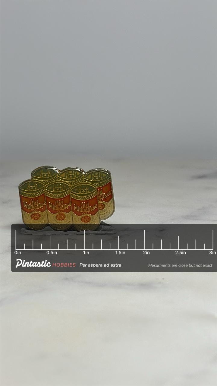 Old Milwaukee Beer Pin: Gold & Red Enamel - Vintage Barware Accessory with ruler overlay for size reference