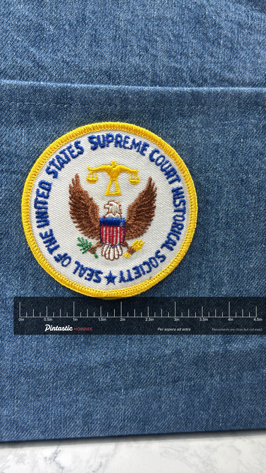 Supreme Court Historical Society Patch: Iron-On White/Gold Round - Government Accessory with ruler overlay for size reference