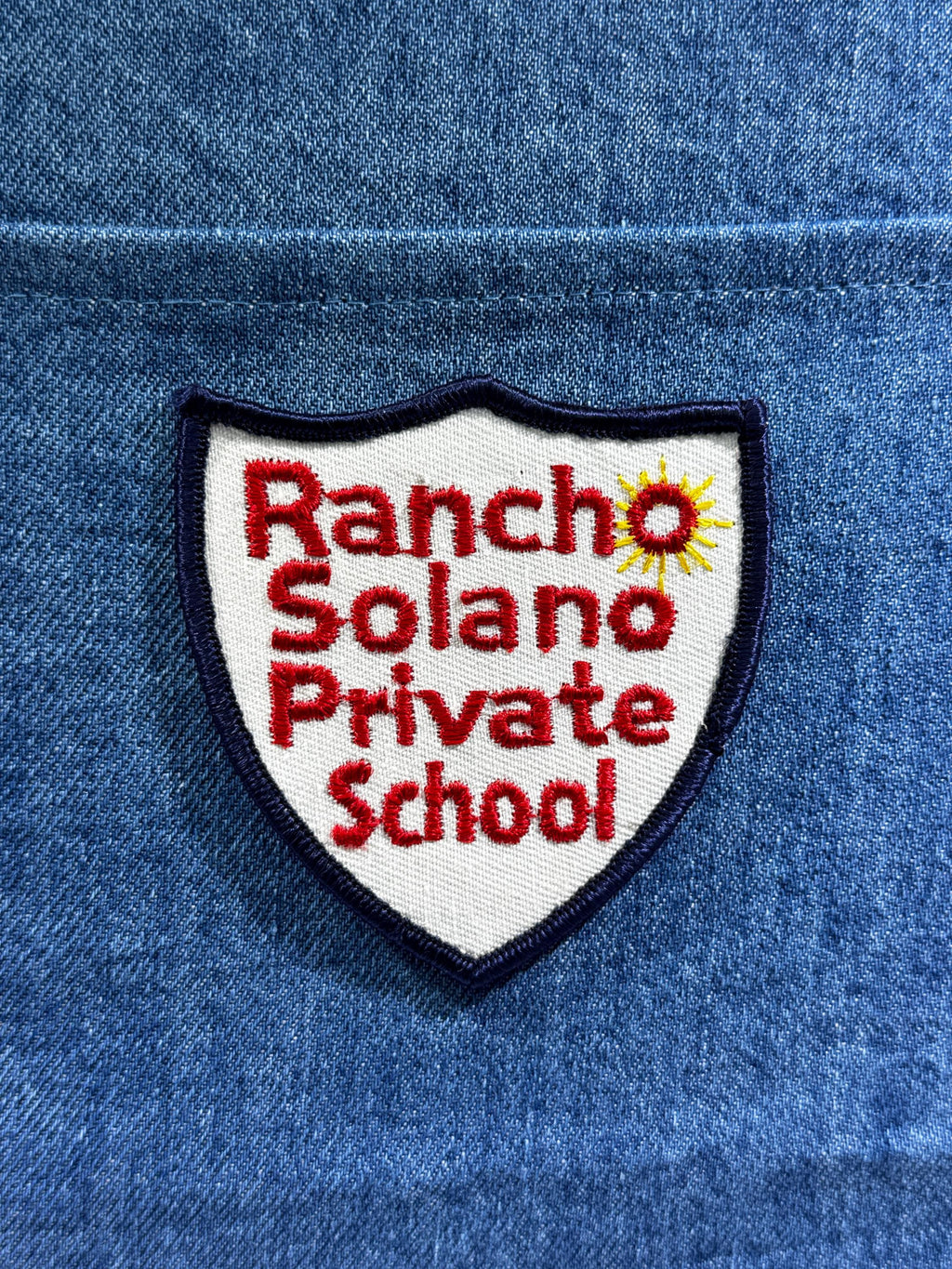 Rancho Solano School Collectable Patch: Iron-On Shield White/Red - Academic Accessory