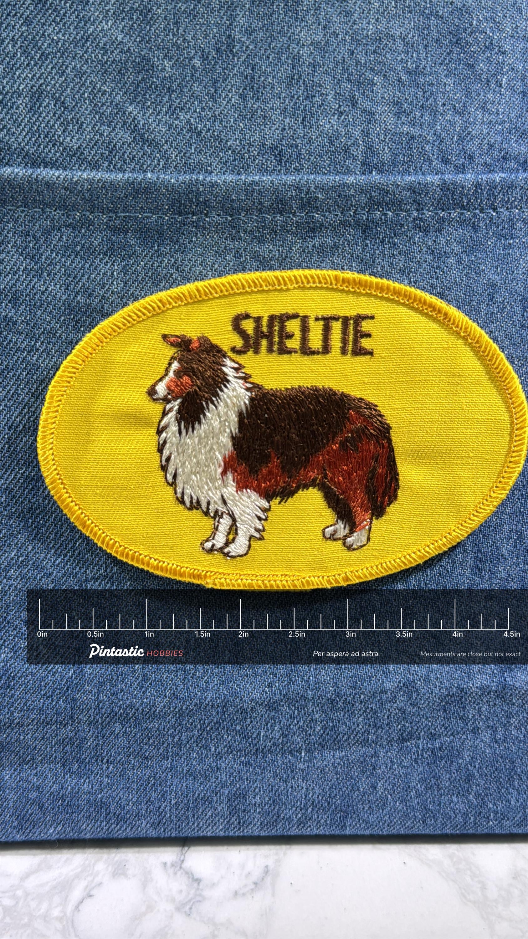 Sheltie Dog Patch: Sew-On Yellow Oval - Dog Breed Accessory with ruler overlay for size reference