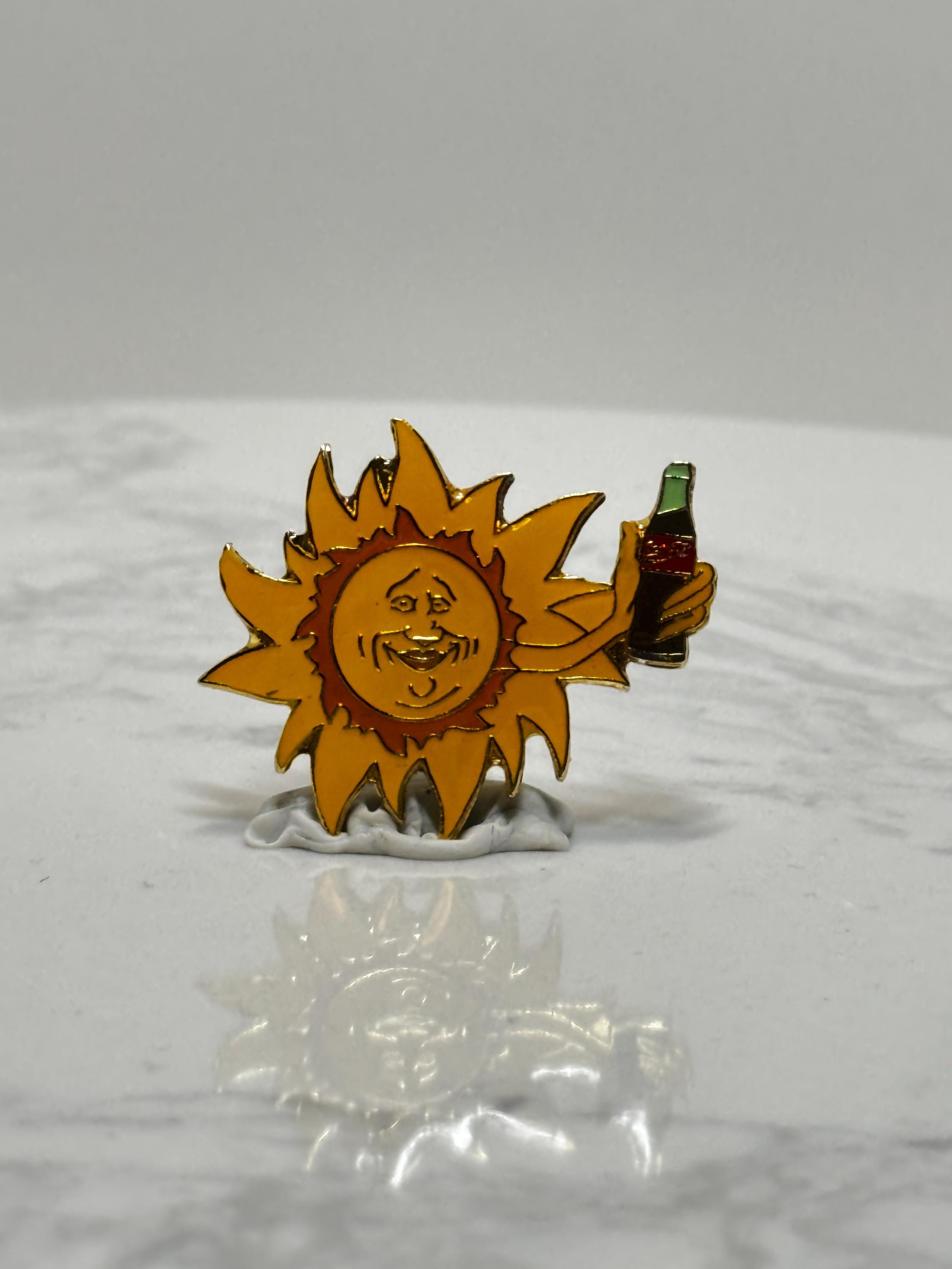 Coca-Cola Sun Holding Drink Enamel Pin: Retro Yellow & Blue - 90s Summer Accessory