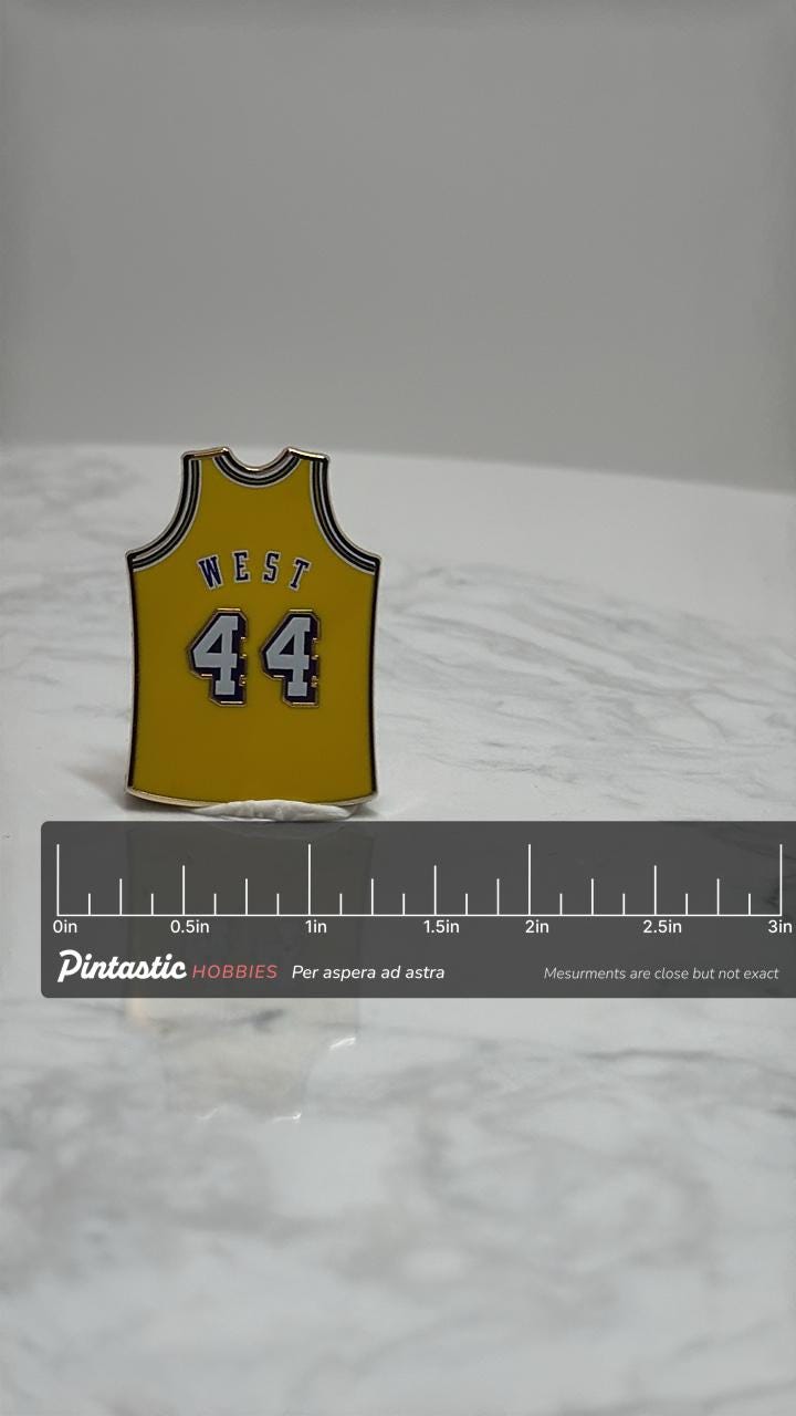 Jerry West Lakers Jersey Pin: Yellow Enamel - Vintage NBA Accessory with ruler overlay for size reference