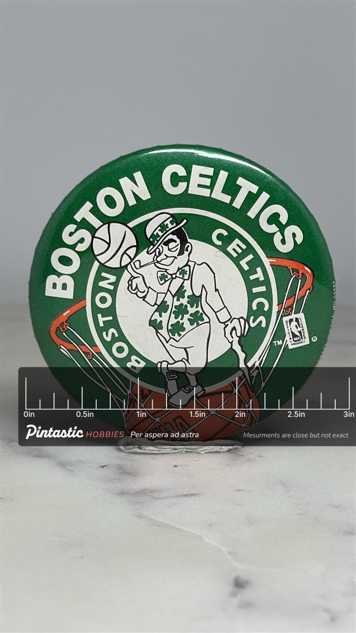 Boston Celtics Basketball Pin: Green & White Finish - Vintage Sports Accessory with ruler overlay for size reference