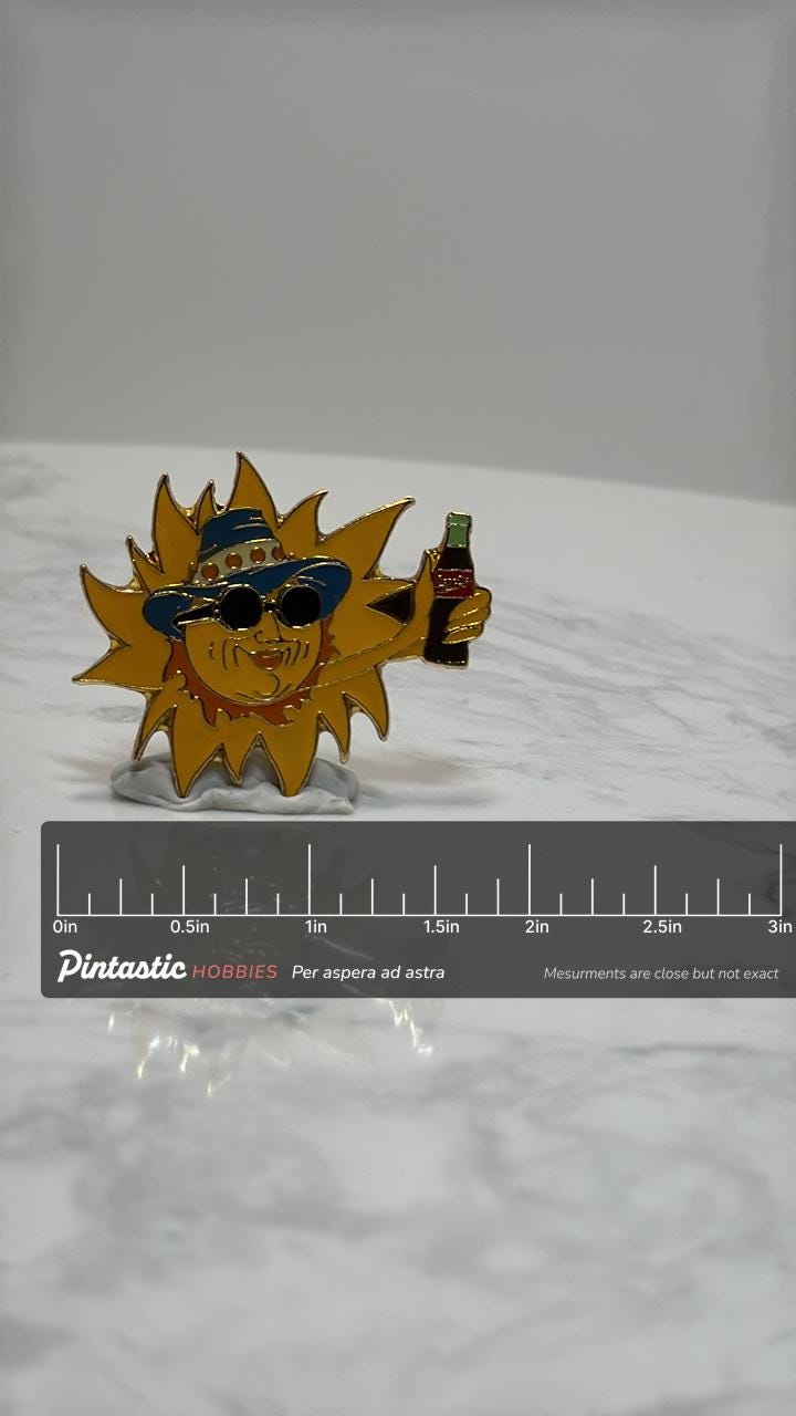 Coca-Cola Sun with Drink Enamel Pin: Retro Yellow & Blue - 90s Summer Accessory with ruler overlay for size reference