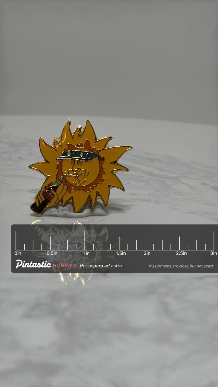 Sun Coca-Cola Enamel Pin: Retro Yellow & Blue - 90s Summer Accessory with ruler overlay for size reference
