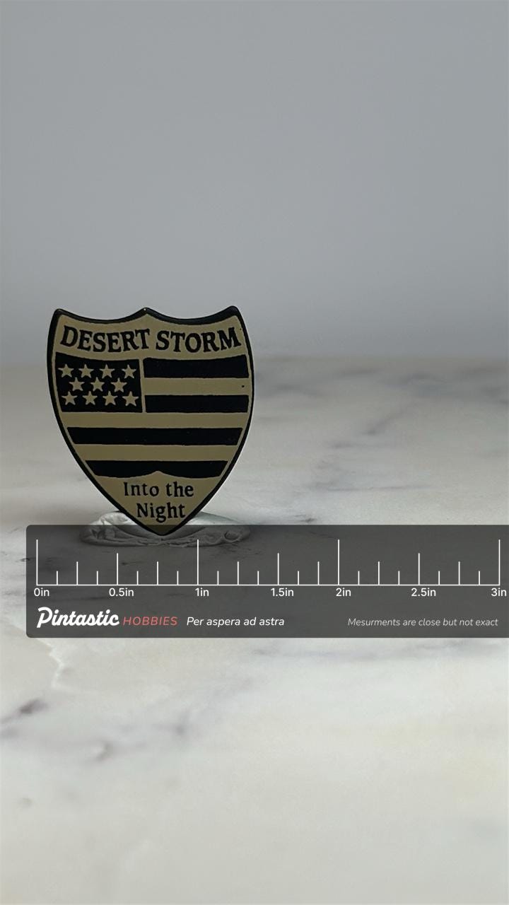Desert Storm Military Pin: Black & Gold Shield - Gulf War Era Accessory with ruler overlay for size reference