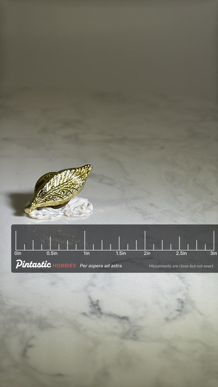 Gold Leaf Lapel Pin: Shiny Metal Finish - Vintage Nature Accessory with ruler overlay for size reference