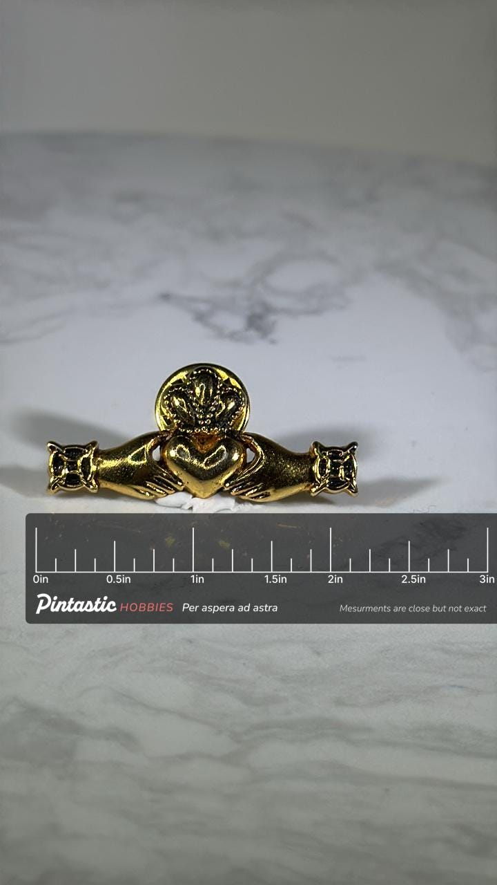 Irish Claddagh Brooch Pin: Gold Tone Finish - Celtic Heritage Accessory with ruler overlay for size reference