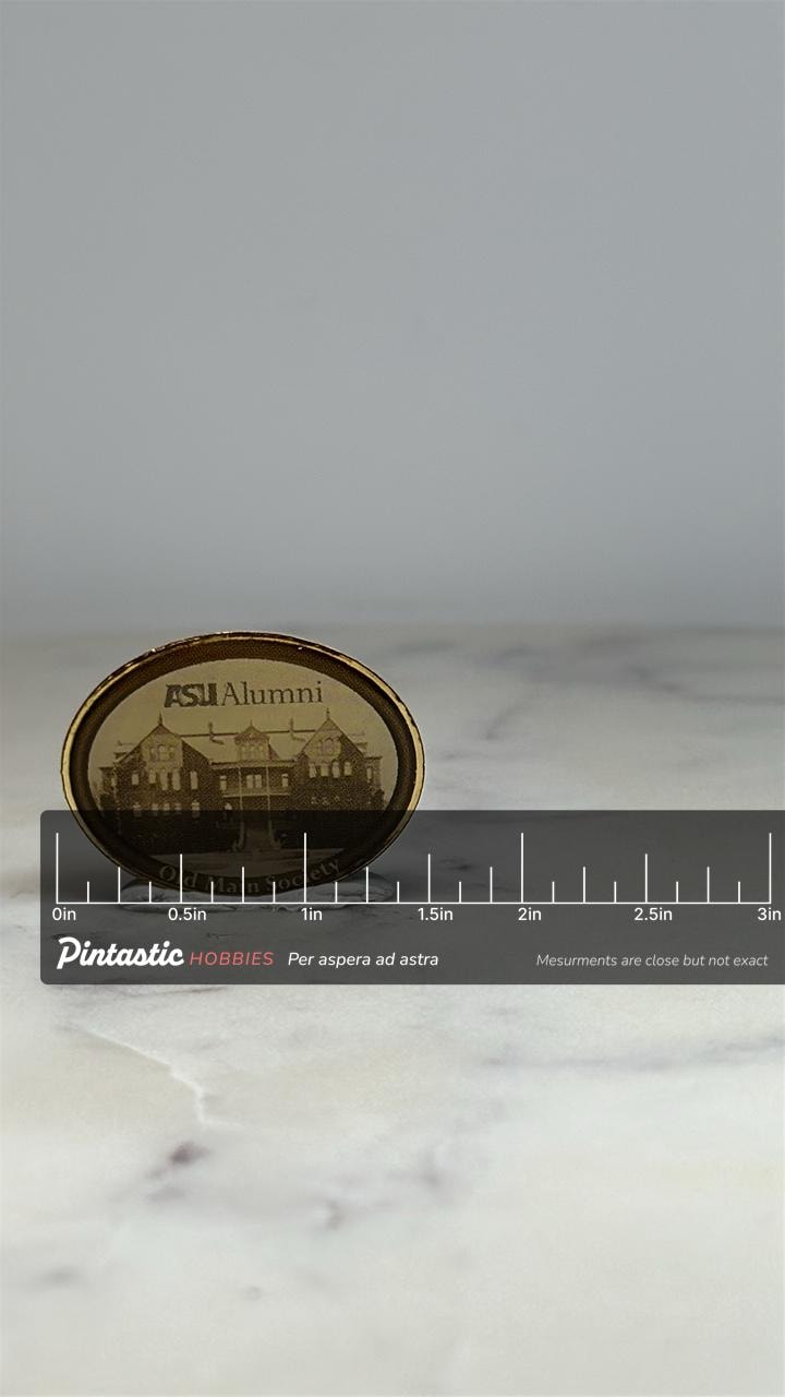 ASU Alumni Lapel Pin: Bronze Oval Finish - Old Main Society Accessory with ruler overlay for size reference