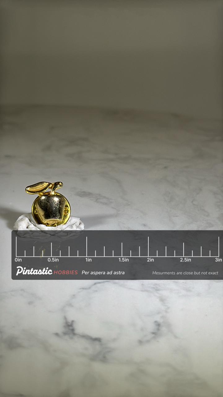 Vintage Apple Lapel Pin: Gold Tone Finish - Teacher Accessory with ruler overlay for size reference