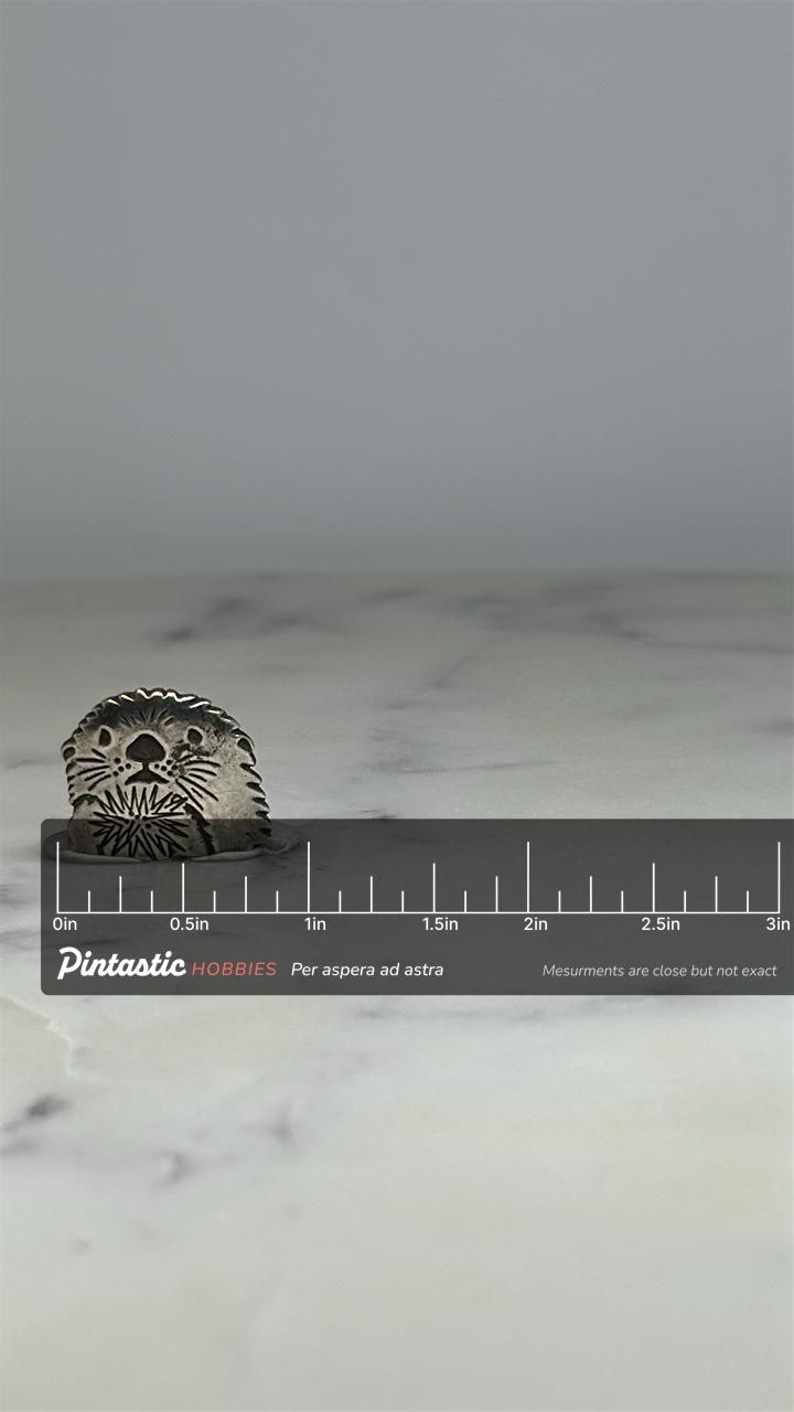Otter Metal Pin: Antiqued Silver Finish - Rustic Animal Accessory with ruler overlay for size reference