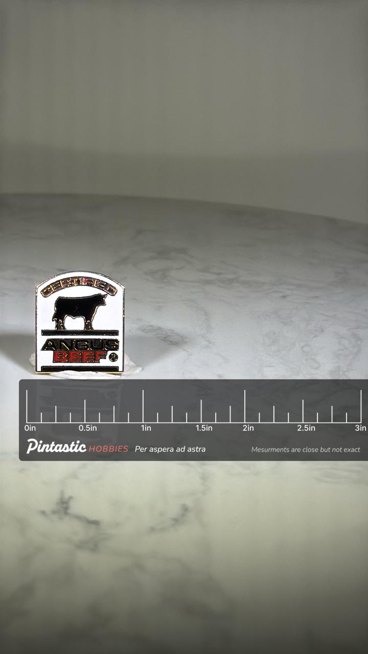 Certified Angus Beef Pin: Black Red Enamel - Vintage Foodie Accessory with ruler overlay for size reference