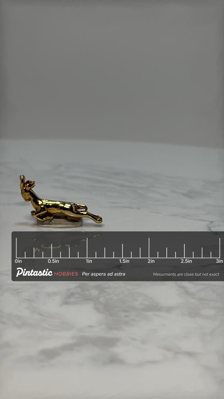 Leaping Deer Lapel Pin: Gold Tone Finish - Vintage Nature Accessory with ruler overlay for size reference
