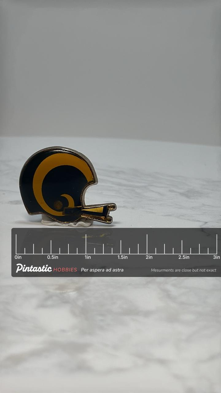 LA Rams Football Helmet Pin: Blue & Gold Enamel - Vintage Sports Accessory with ruler overlay for size reference