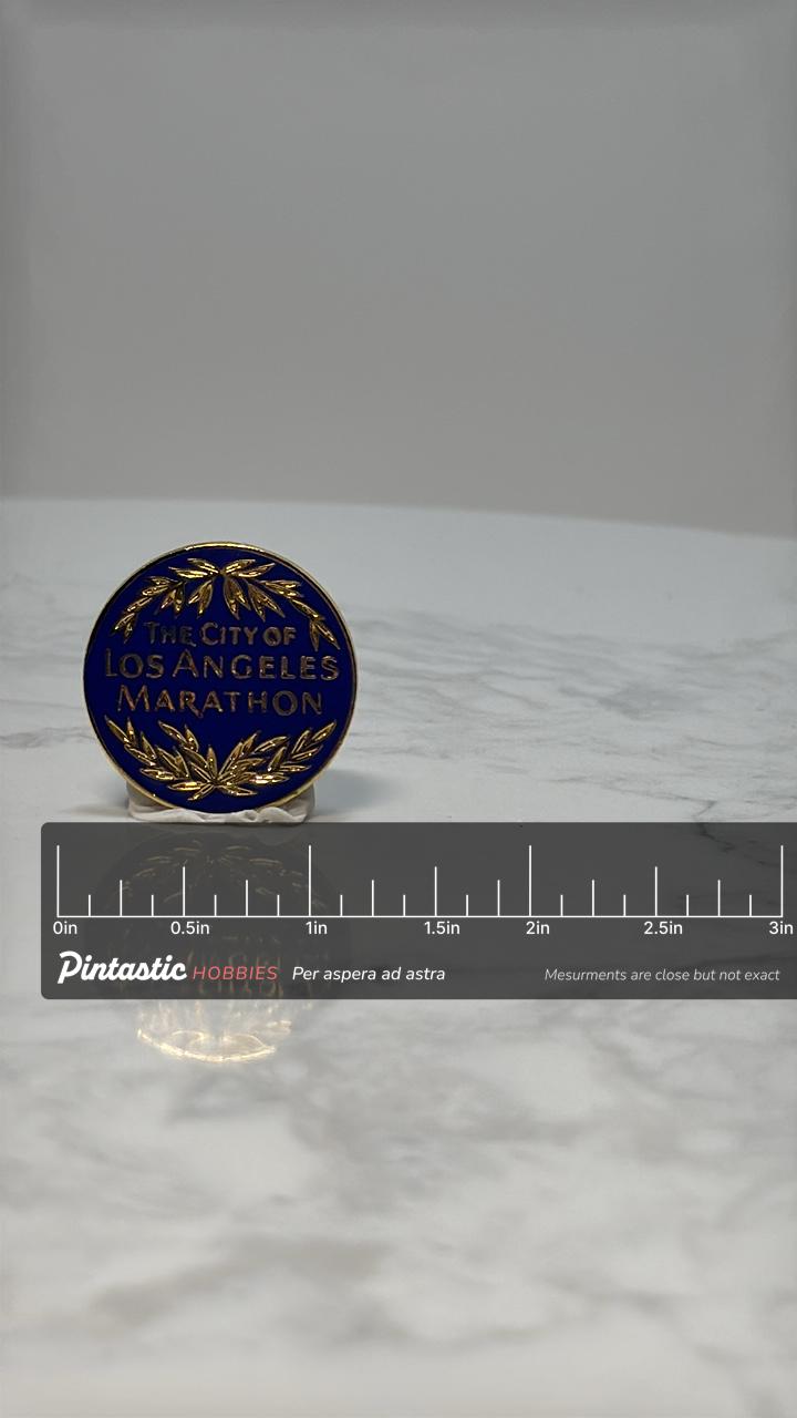 Los Angeles Marathon Pin: Gold Laurel on Blue - Athletic Event Accessory with ruler overlay for size reference