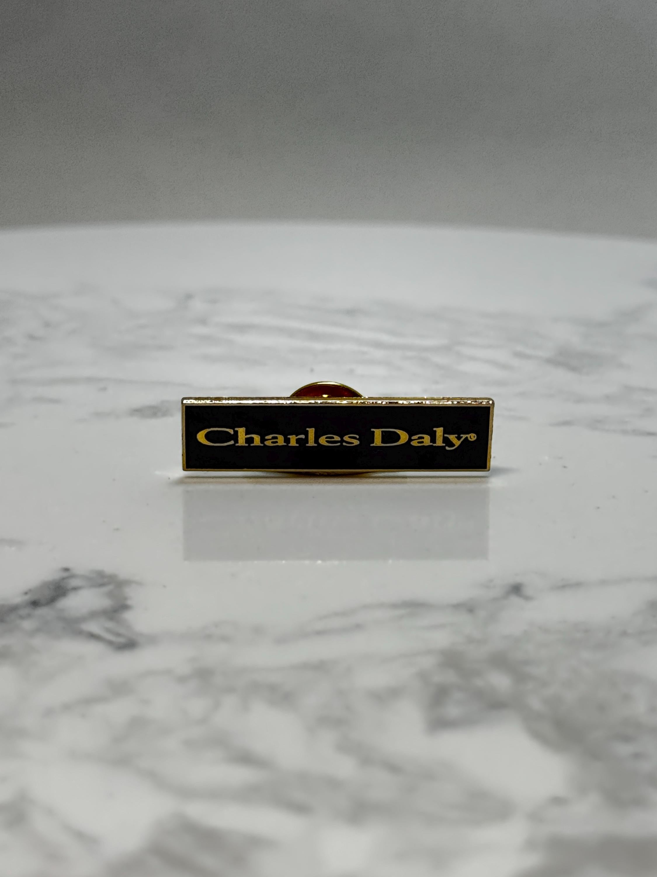 Charles Daly Nameplate Pin: Black & Gold Enamel - Vintage Accessory