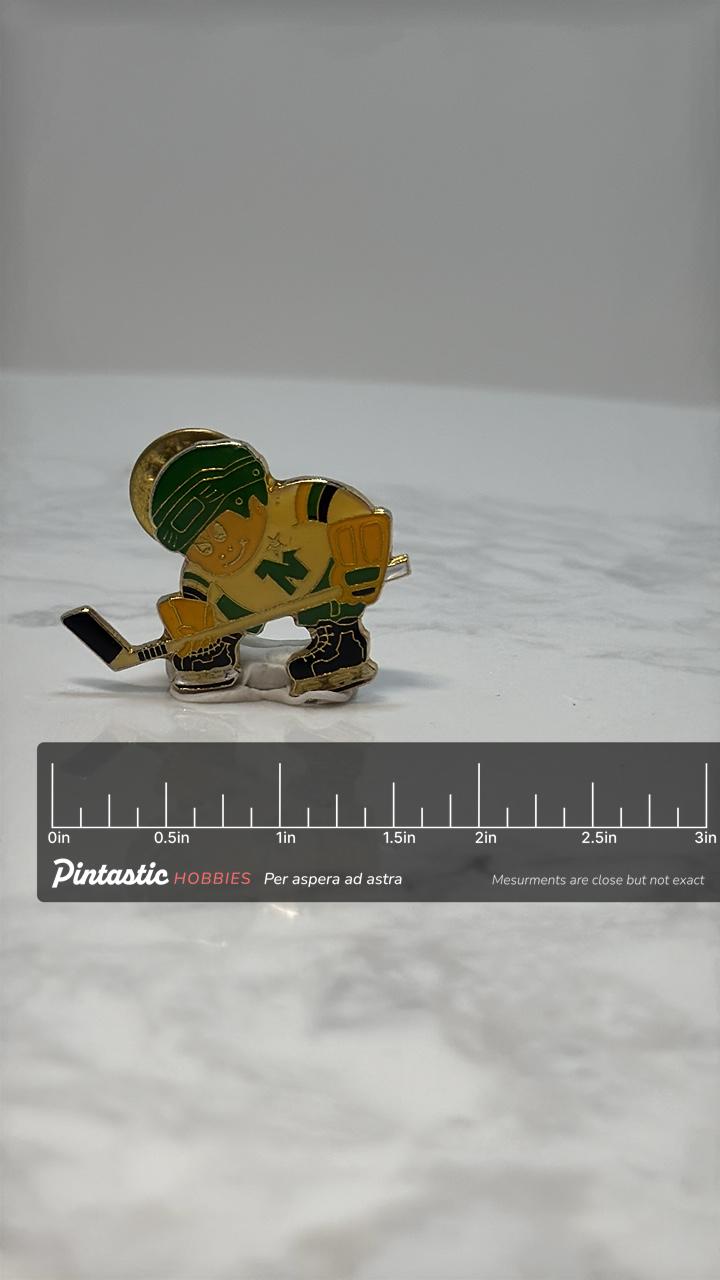 Vintage Hockey Player Pin: Yellow Green Enamel - Retro Sports Accessory with ruler overlay for size reference
