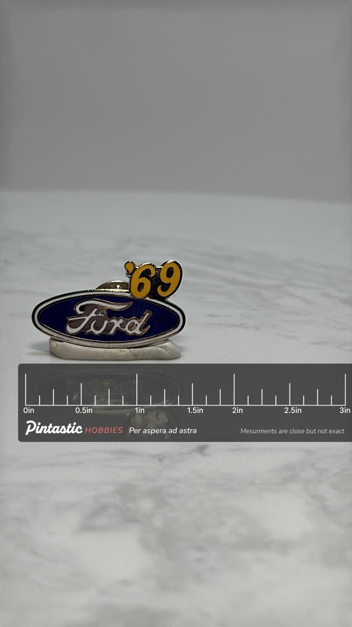 Ford '69 Logo Pin: Blue Enamel - Vintage Car Collectible Accessory with ruler overlay for size reference