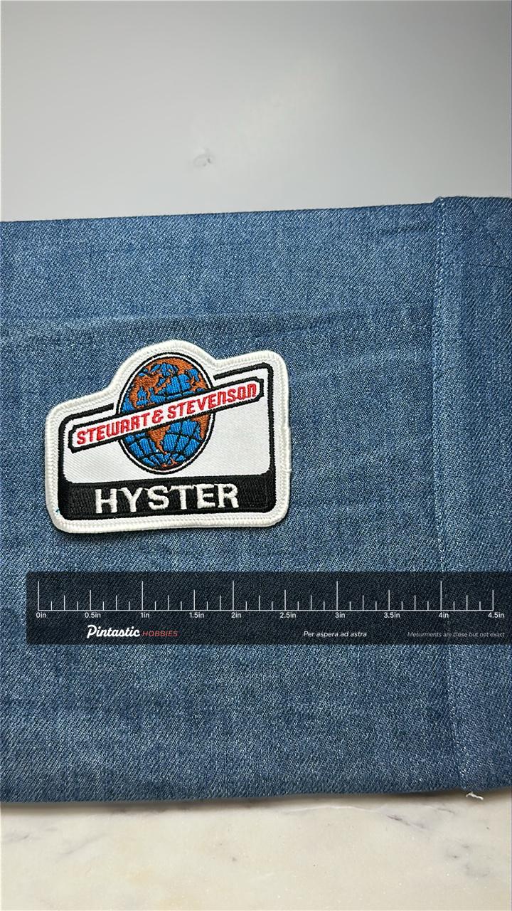 Stewart & Stevenson Hyster Collectable Patch: White/Black - Industrial Era Accessory with ruler overlay for size reference