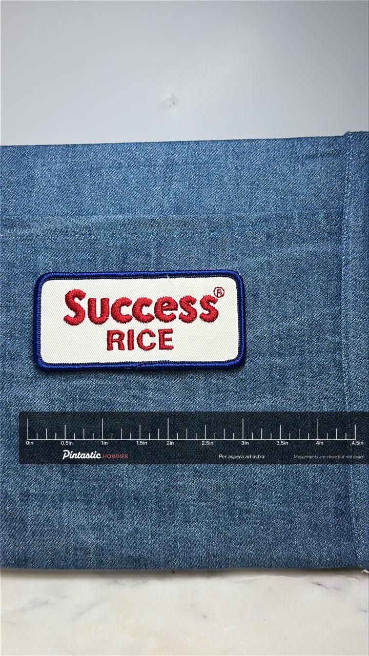 Success Rice Collectable Patch: Red/White/Blue - Vintage Brand Accessory with ruler overlay for size reference