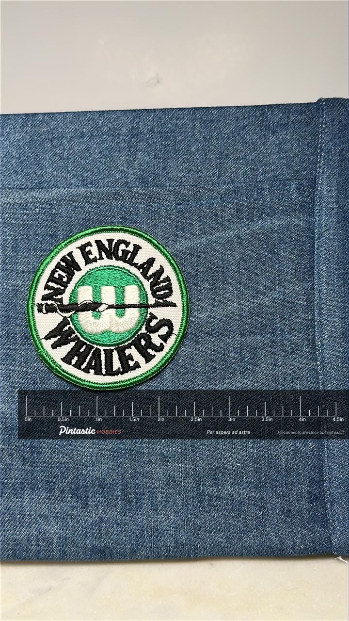New England Whalers Collectable Patch: Green & White - Vintage Sports Accessory with ruler overlay for size reference