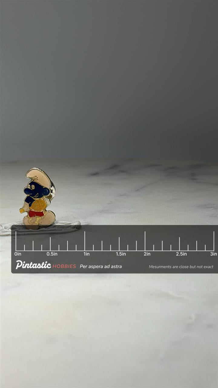 Smurf Tennis Player Enamel Pin: Blue White Gold - 1980s Cartoon Accessory with ruler overlay for size reference