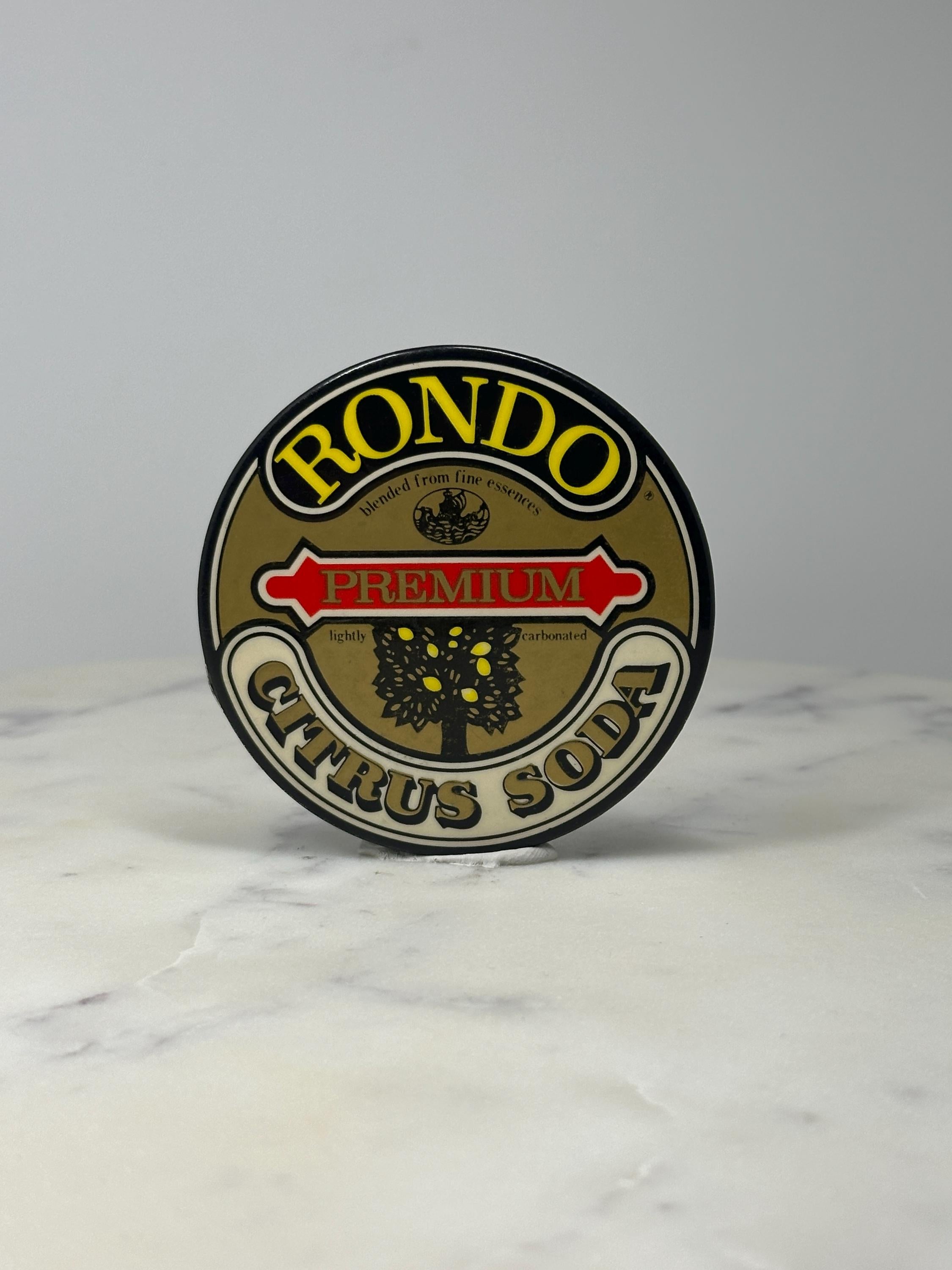 Rondo Citrus Soda Advertising Button Pin: Brown Logo - Vintage Beverage