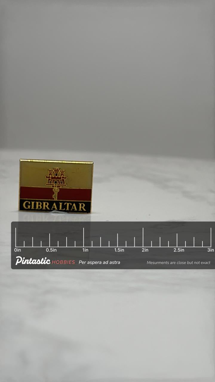 Gibraltar Flag Lapel Pin: Gold Enamel Finish - Travel Souvenir Accessory with ruler overlay for size reference