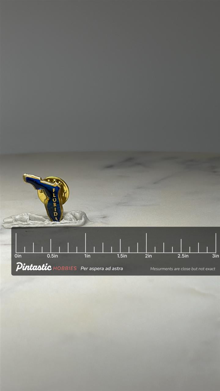 Florida State Souvenir Lapel Pin: Blue Enamel Gold Tone - Travel Accessory with ruler overlay for size reference