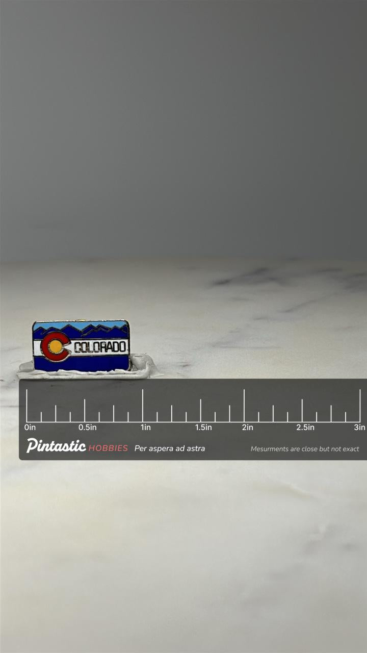 Colorado State Flag Enamel Pin: Blue Mountain Design - USA Travel Accessory with ruler overlay for size reference