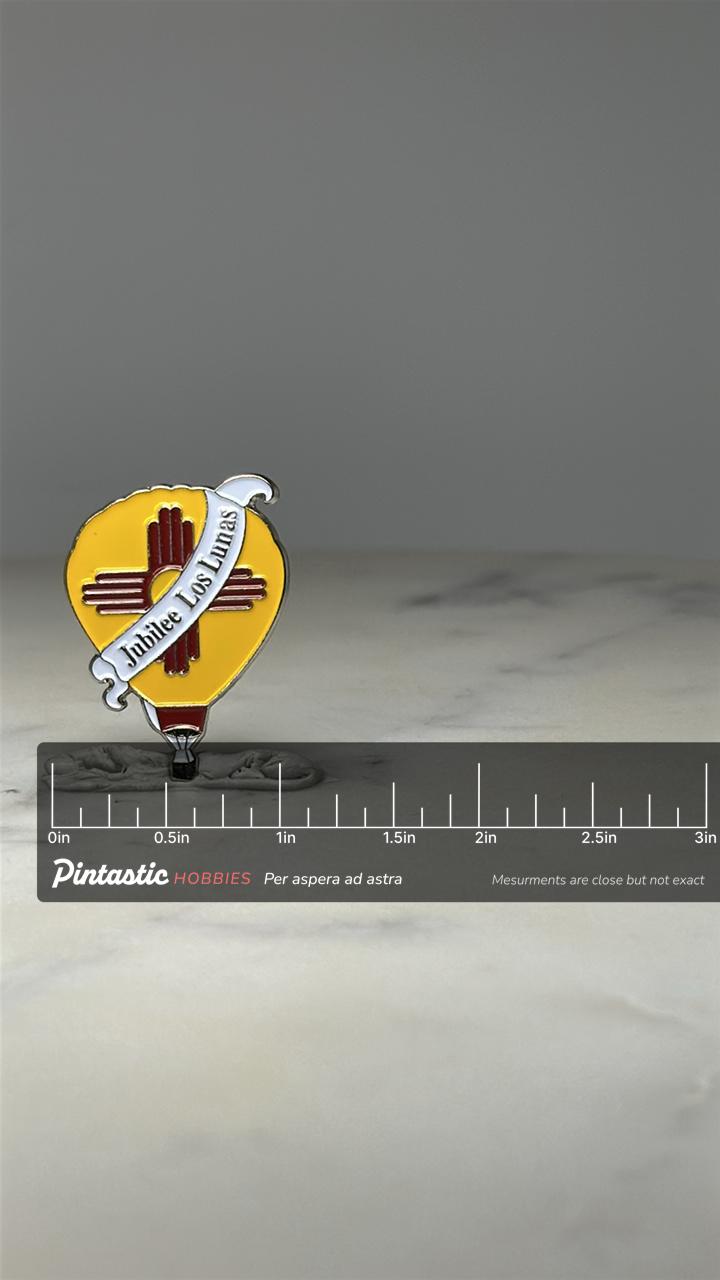 Jubilee Los Lunas Balloon Pin: Enamel Yellow - NM Souvenir Accessory with ruler overlay for size reference