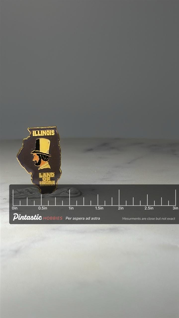 Illinois Land of Lincoln Enamel Pin: Gold Tone - State Souvenir with ruler overlay for size reference