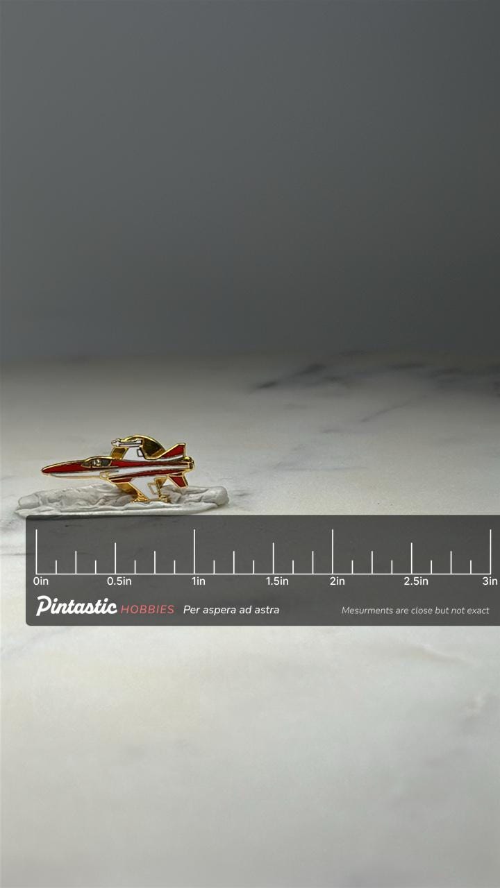 Red White Fighter Jet Pin Gold Tone Enamel Aviation Lapel Pin with ruler overlay for size reference