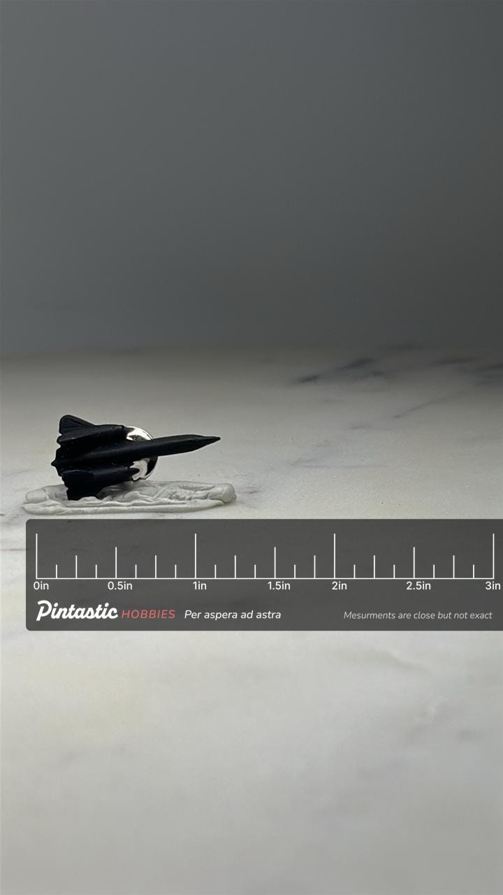 SR-71 Blackbird Jet Pin: Black Metal - Cold War Aviation Accessory with ruler overlay for size reference