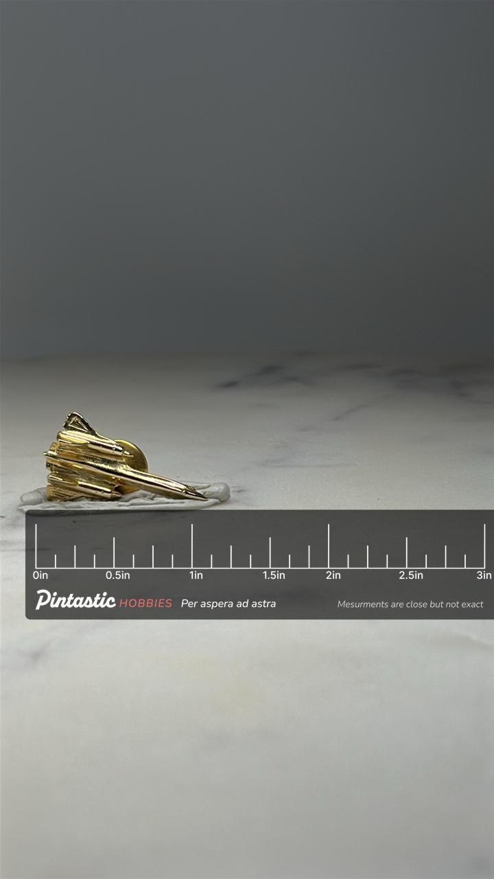 Delta Wing Interceptor Jet Pin Canard Style Military Aircraft Gold Lapel Pin with ruler overlay for size reference