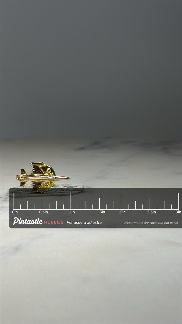 Cold War Interceptor Jet Pin Gold Tone Military Aircraft Lapel Pin with ruler overlay for size reference