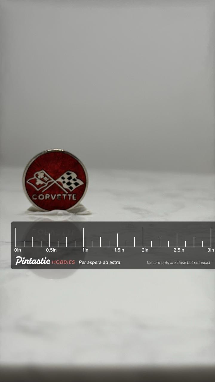 Corvette Emblem Lapel Pin: Red Enamel - Classic Car Accessory with ruler overlay for size reference