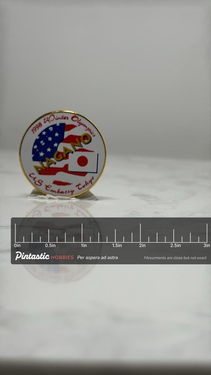1998 Nagano Winter Olympics Pin: Enamel US Embassy Tokyo - Olympic with ruler overlay for size reference