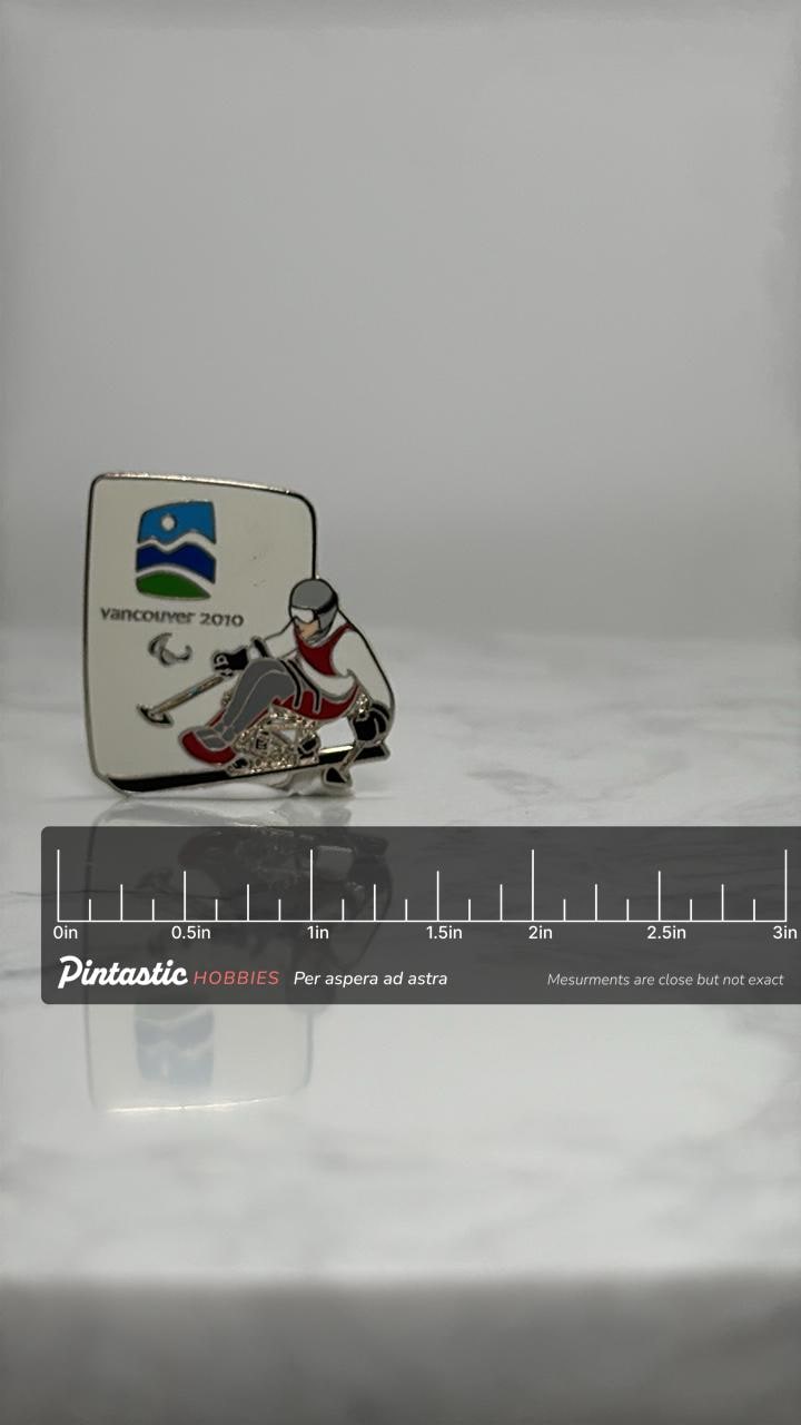 Vancouver 2010 Paralympic Pin: Enamel Sit Ski - Winter Games Accessory with ruler overlay for size reference
