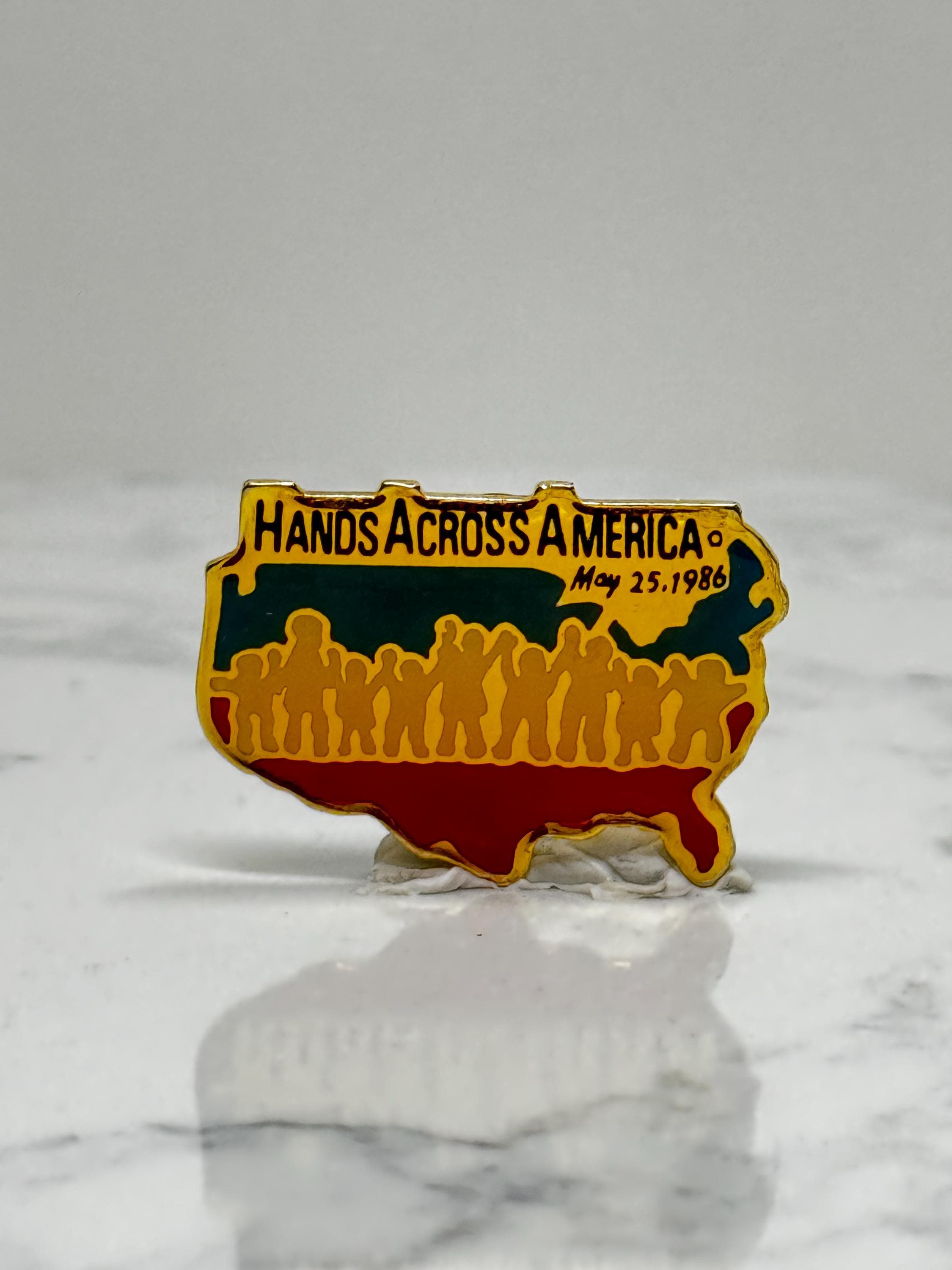 Hands Across America Pin: Gold Enamel - 1986 Charity Event