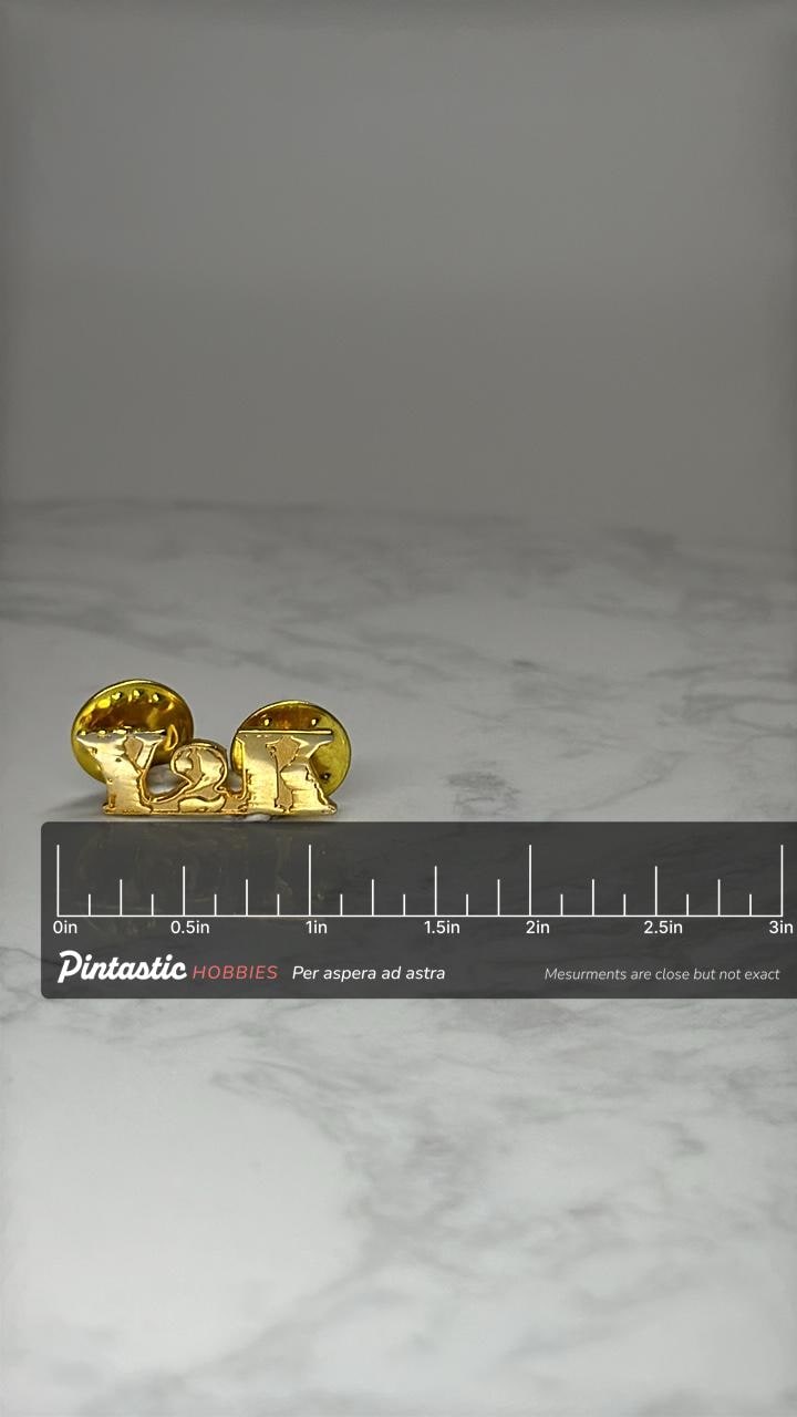 Y2K Letter Lapel Pin: Gold Tone - 2000s Millennium Accessory with ruler overlay for size reference